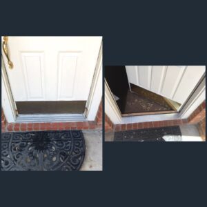 Door with damaged threshold and welcome mat.