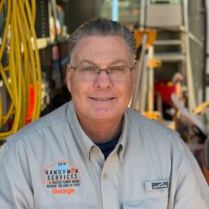 Handyman smiling in work environment.